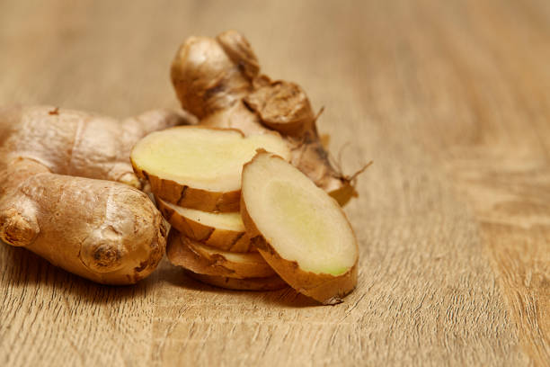 istock Ginger root sliced on wooden table 978023434