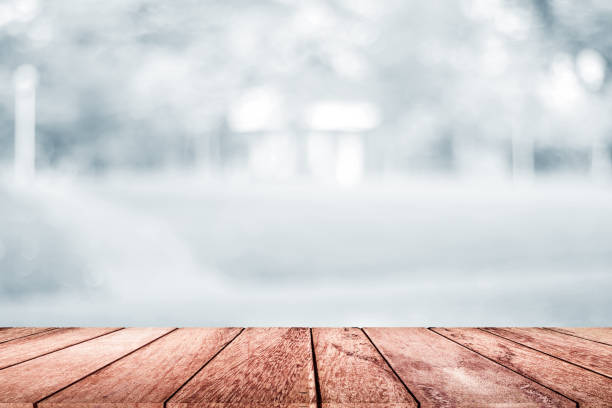 istock empty wooden on white blurred nature backdrop. Wood table top. can used for display or montage your products 978043052