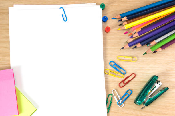 istock white paper blank and pen, pencil, paper note, paperclip on desk / can be used for write text message 978043136