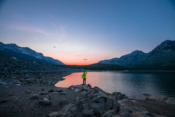 istock a man at lake minnewanka 978044290