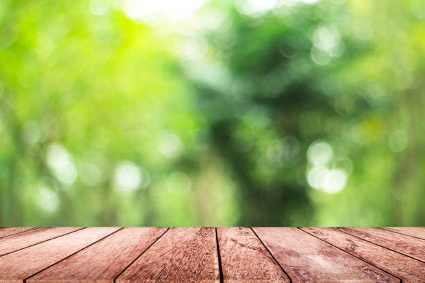 istock empty wooden on blurred nature backdrop. Wood table top. can used for display or montage your products 978044406