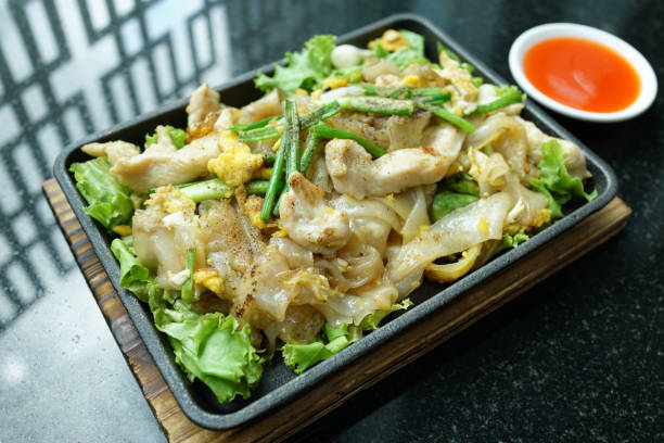 istock Stir fried noodles with chicken and egg 978047342