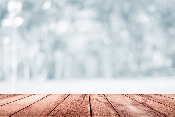 istock empty wooden on white blurred nature backdrop. Wood table top. can used for display or montage your products 978051866