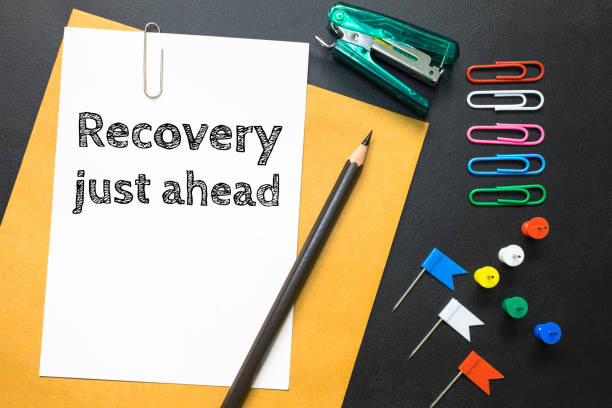 istock Text recovery just ahead on white paper background / business concept 978061384