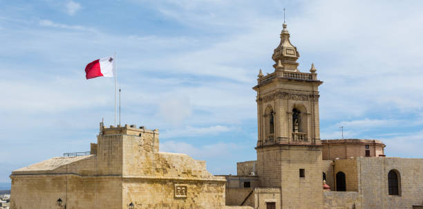 istock Cathedral and flag of Malta 978066604