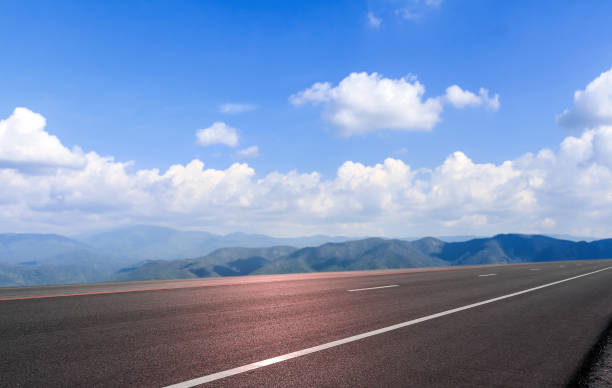 istock Road asphalt and mountain sky cloud background 978083074