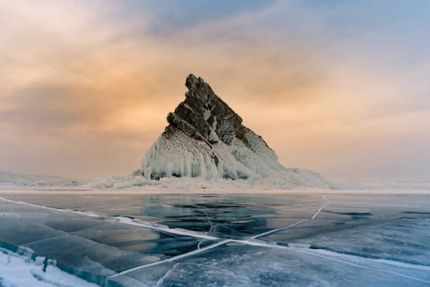 istock Rock on freeze lake with sunrise sky background 978096768