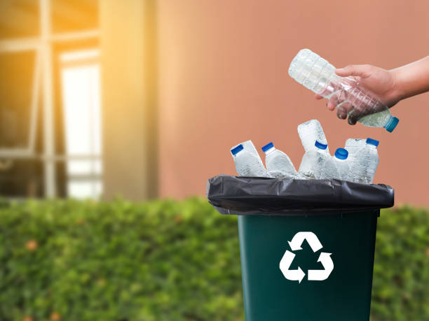 istock man hand putting plastic reuse for recycling concept environmental protection world recycle 978132422