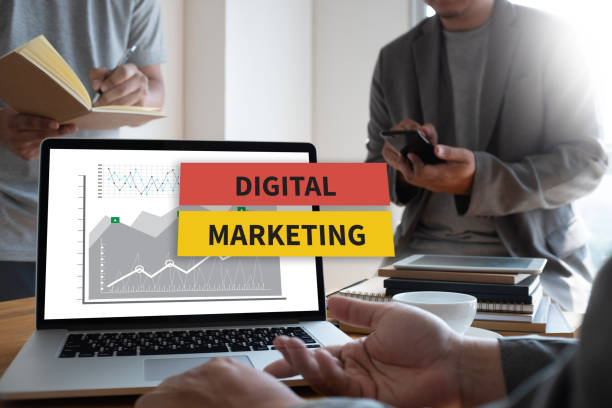 istock DIGITAL MARKETING new startup project MILLENNIALS Business team hands at work with financial reports and a laptop 978132510