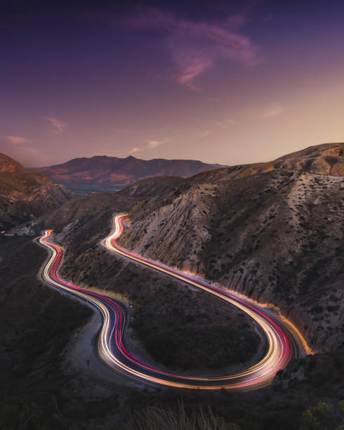 Grimes Canyon Long Exposure with car trails and milkyway Grimes Canyon near Los Angeles night photography driving winding road stock pictures, royalty-free photos & images