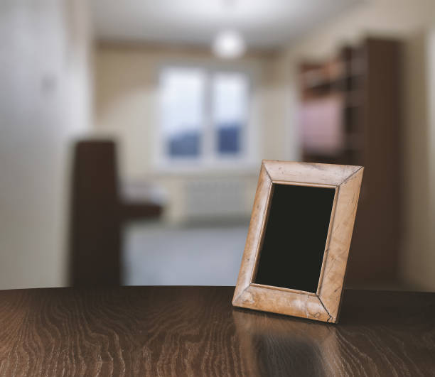 istock old photo frame on the wooden table 978176190
