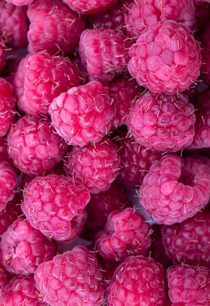 istock Background with fresh sweet raspberries. 978178854