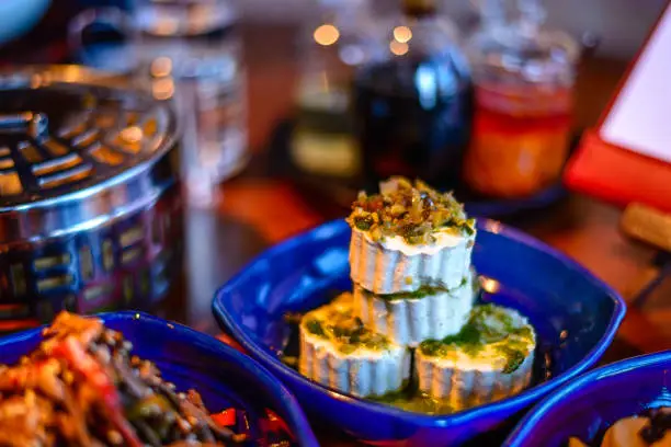 Assortment of Classic Northern China Cold Appetisers in fine-dining restaurant: cold tofu appetizer is topped with finely chopped century egg