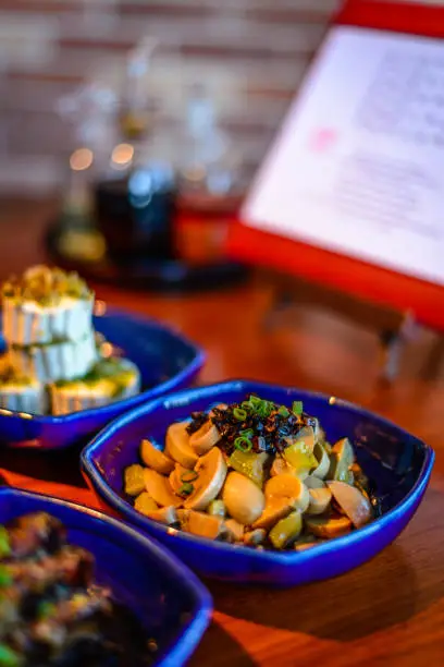 Assortment of Classic Northern China Cold Appetisers in fine-dining restaurant: button mushrooms are accentuated with Chinese truffle.