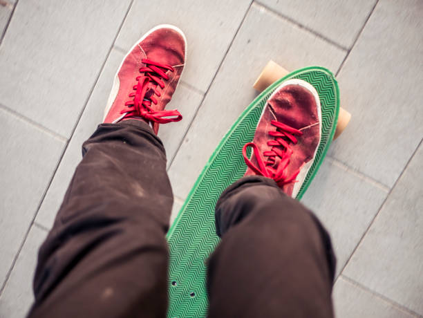istock first person view person riding a penny skate board outside 978179280