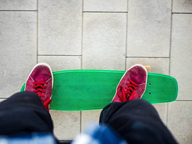 istock first person view of man riding the modern plastic skateboard 978181518