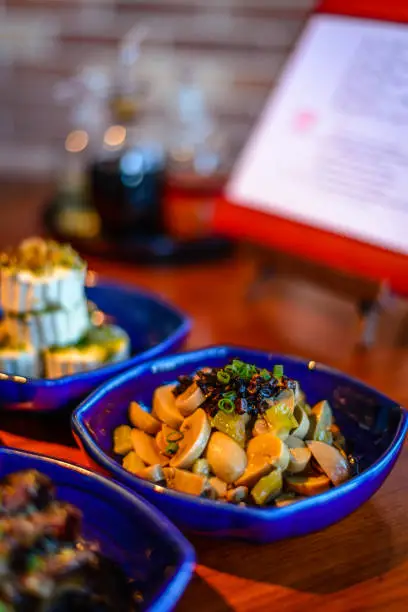 Assortment of Classic Northern China Cold Appetisers in fine-dining restaurant: button mushrooms are accentuated with Chinese truffle.