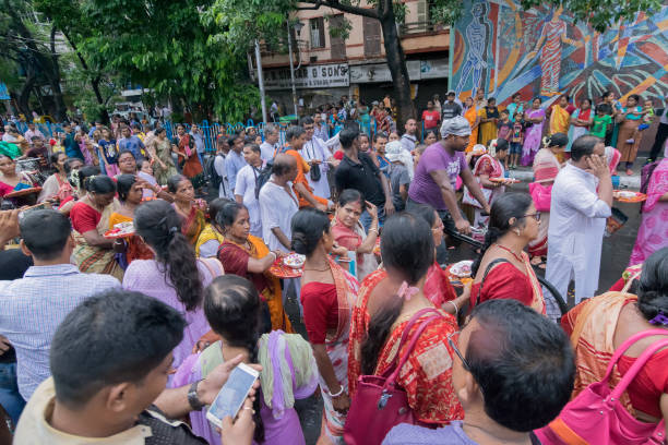 KOLKATA, WEST BENGAL , INDIA - JUNE 25TH 2017 : Devotees dancing spiritually on Rath yatra fetival in Kolkata city. God Jagannath, Balaram and Goddess Suvadra are taken outside of temples for a chariot ride in city.