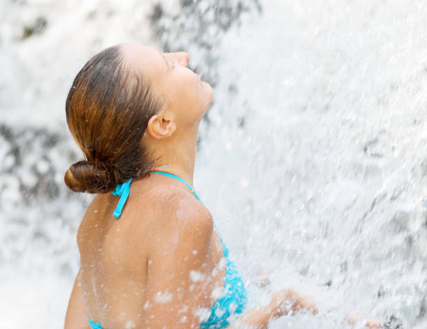 istock Young woman relaxing in waterfall 978206164