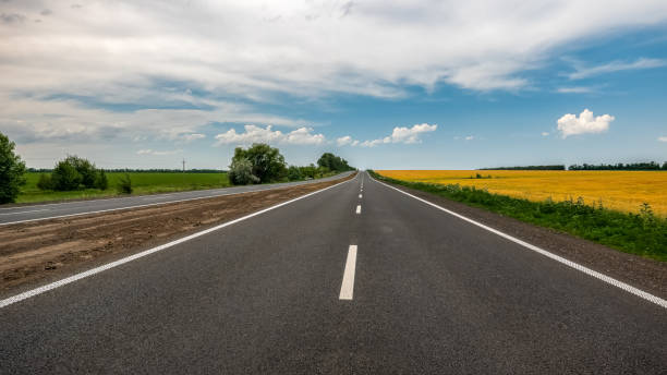 istock white road markings on the asphalt road surface. 978211086