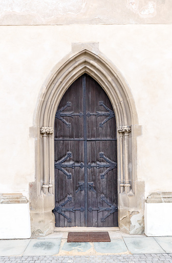 Old church or castle front door with iron ornaments