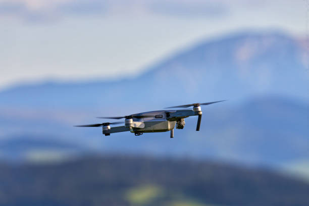 istock Drone with camera flying over mountain fields. Aerial photography and videography 978232440