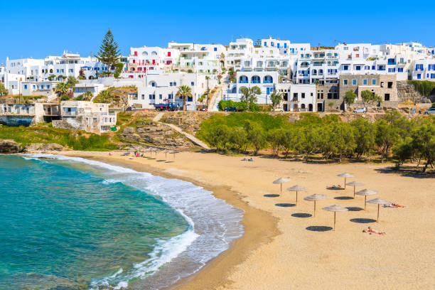 View of beautiful sea bay with beach in Naoussa town, Paros island, Greece The island of Paros is one of the most famous Greek islands of the Aegean Sea and it belongs to the Cyclades islands archipelago. paros stock pictures, royalty-free photos & images