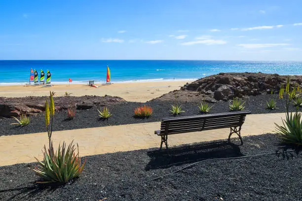 Photo of Bench on coastal promenade on Jandia peninsula, Morro Jable, Fuerteventura, Canary Islands, Spain