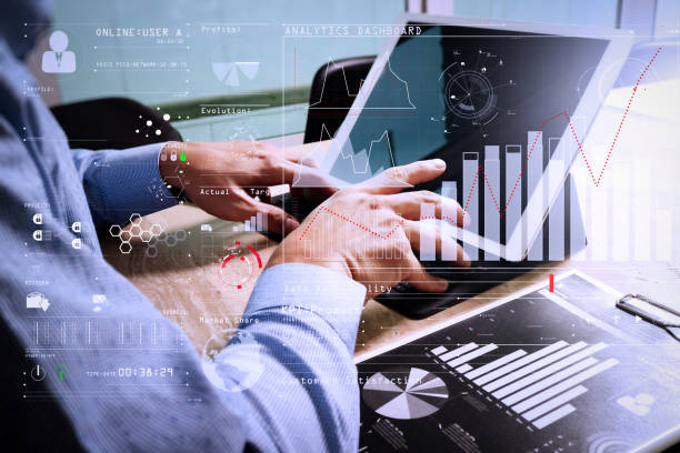istock Businessman hand working concept. Documents finance graphic chart. Digital tablet keyboard dock screen computer design smart phone using. Eyeglass on marble desk. Sun flare effect 978242806