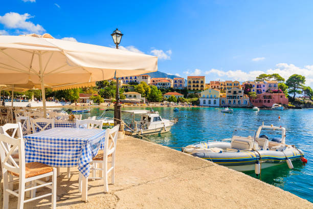 Beautiful Greek port in Assos village on Kefalonia island, Greece Kefalonia is a Greek island in Ionian Sea. It is the largest of Ionian islands and the sixth largest Greek island. corfu stock pictures, royalty-free photos & images