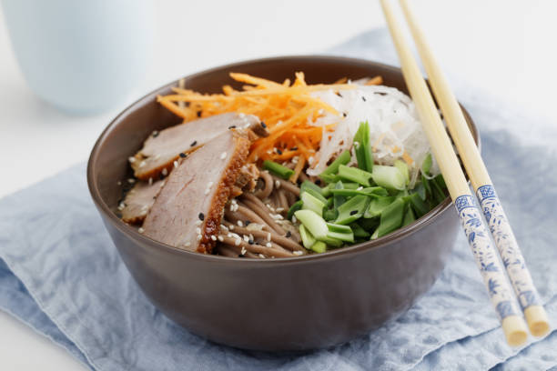 istock Duck breast with soba noodles and vegetables 978249504