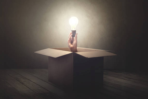 istock han holding light bulb coming out from a paper box 978249810