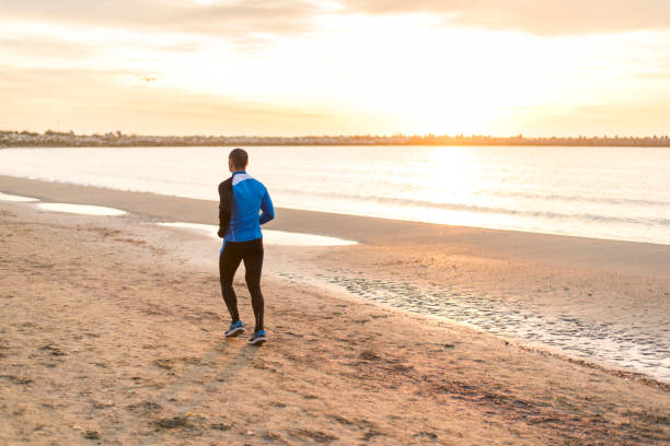 istock Jogging on the beach early in the morning 978249858