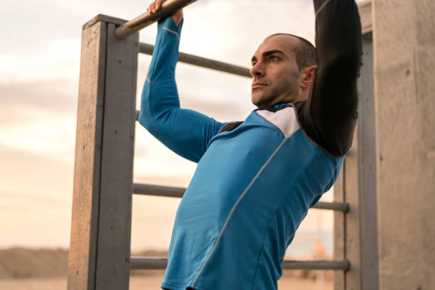 istock Sporty man doing chin-ups 978250192