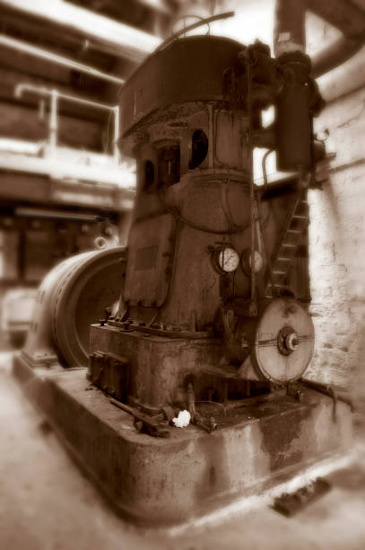 istock OLD MACHINERY IN DERELICT TEXTILE MILL 978254872