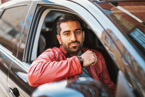 crowdsourced taxi driver in england - india car people business imagens e fotografias de stock