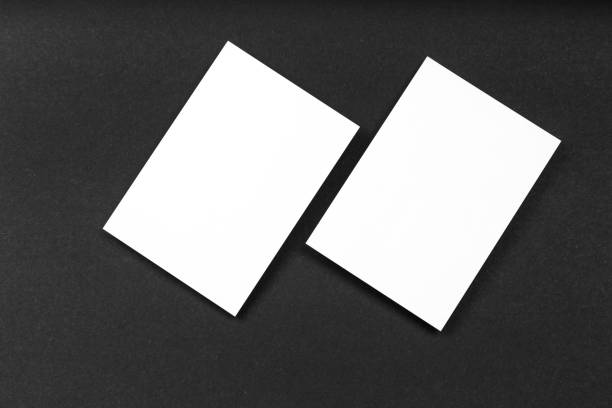 istock Blank portrait A4. brochure magazine isolated on black, changeable background / white paper isolated on black 978264660