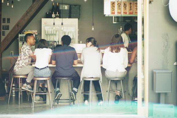 istock Various ethnic friends enjoying a dinner at Japanese pub 978268048