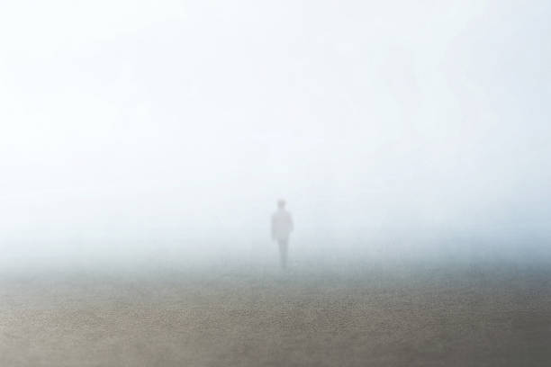 man walking in the fog