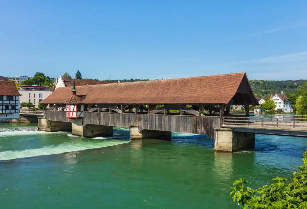 Medieval bridge over the Reuss river in the town of Bremgarten in summertime. Bremgarten is a municipality in the Swiss canton of Aargau, its medieval old town is listed as a heritage site of national significance.