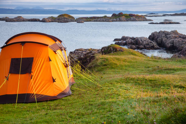 istock Camping tent on ocean shore at Scottish Highlands 978295086