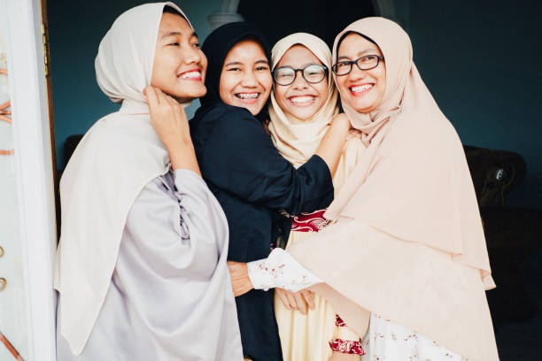 istock Mom and daughters laughing and showing the happiness 978296030
