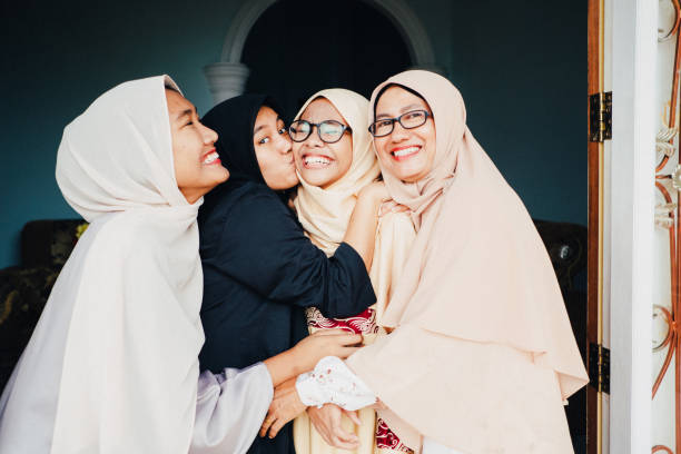 istock Mom and daughters laughing and showing the happiness 978296036