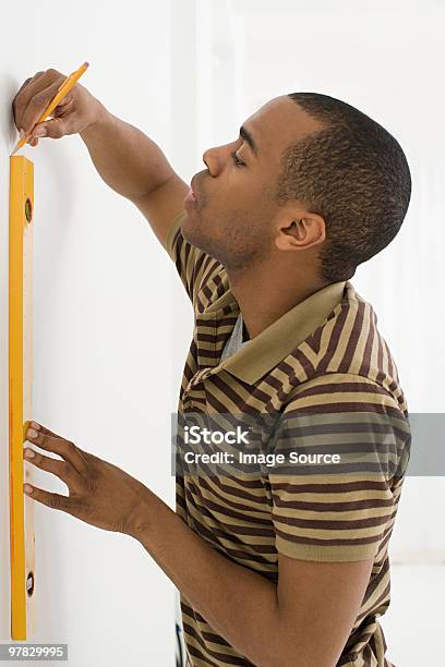 Man Using Spirit Level Stock Photo - Download Image Now - Measuring, Vertical, 35-39 Years