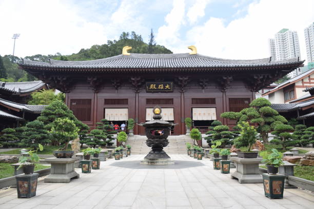View of Chi Lin nunnery buddhist temple in Diamond Hill, Hong Kong - China Hong Kong, China - June 18, 2018 - The complex was founded in 1934 as a retreat for Buddhist nuns and was rebuilt in the 1990s following the traditional Tang Dynasty architecture. chi lin nunnery stock pictures, royalty-free photos & images