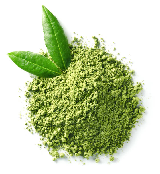 Green matcha tea powder Heap of green matcha tea powder and leaves isolated on white background. Top view chlorella stock pictures, royalty-free photos & images