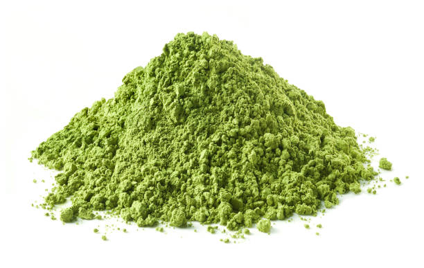 Heap of green matcha tea powder Heap of green matcha tea powder isolated on white background chlorella stock pictures, royalty-free photos & images