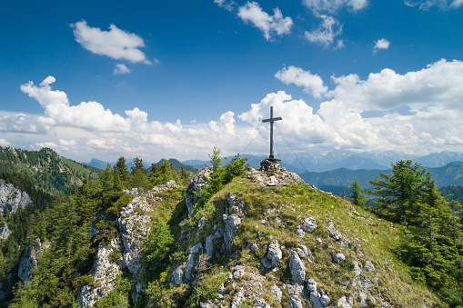 Aerial of the traditional wooden Katzenstein Summit Cross Gipfelkreuz. Austria, European Alps