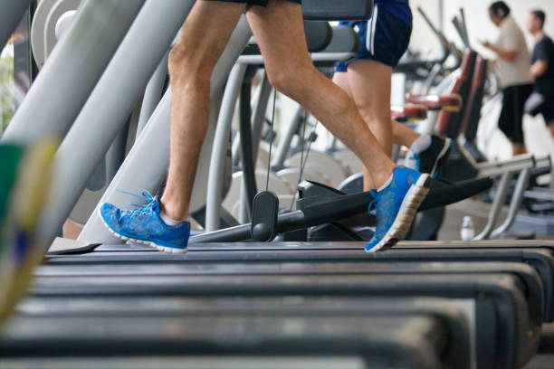 istock Low section of people jogging on treadmill 978317812