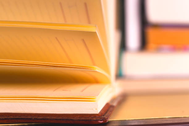 istock Open book, hardback books on bright colorful background. 978321040